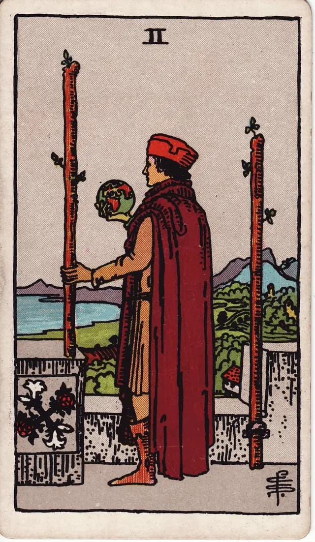 ภาพไพ่ Two of Wands (2 ไม้เท้า) จากสำรับ Rider–Waite–Smith